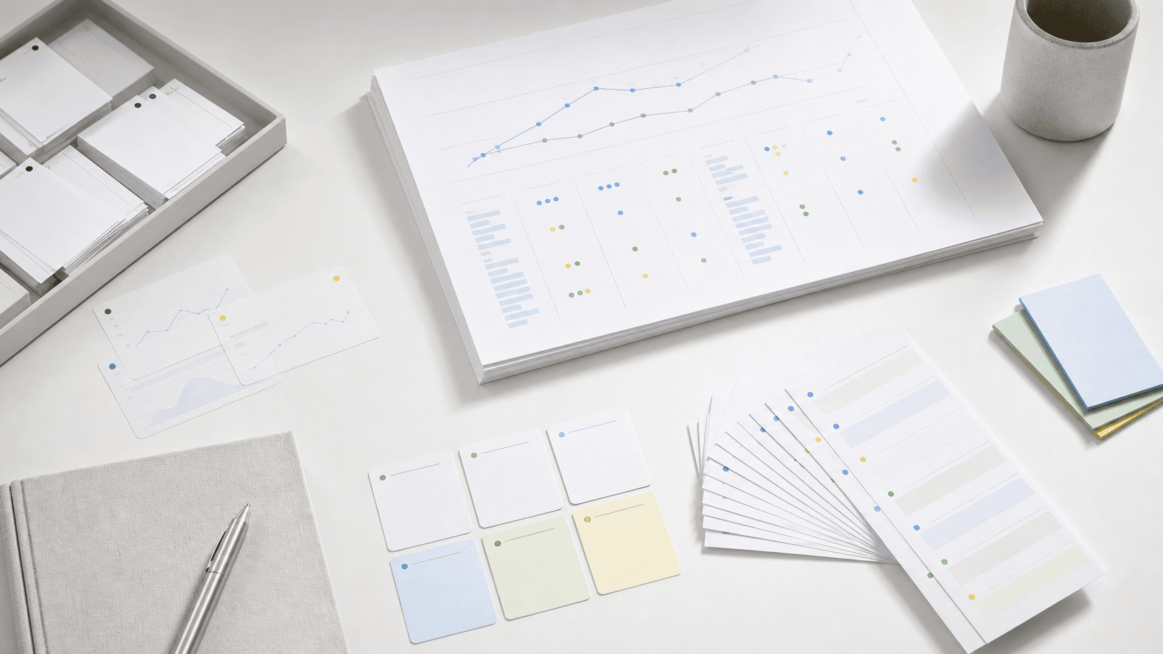 Class summary sheets and learning signals arranged on a white desk.